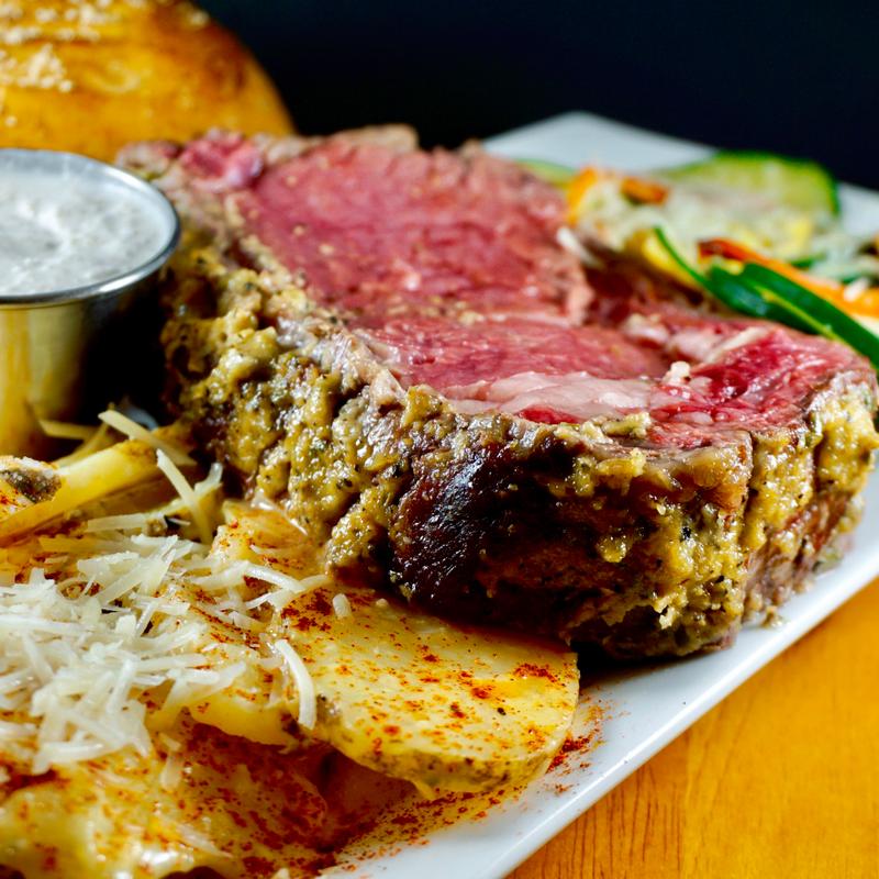 Horseradish-encrusted prime rib with vegetables and potatoes